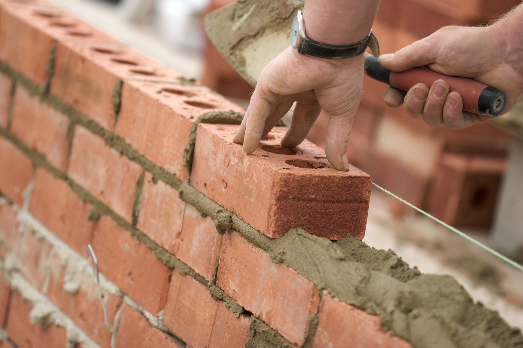 Bricklayer building wall